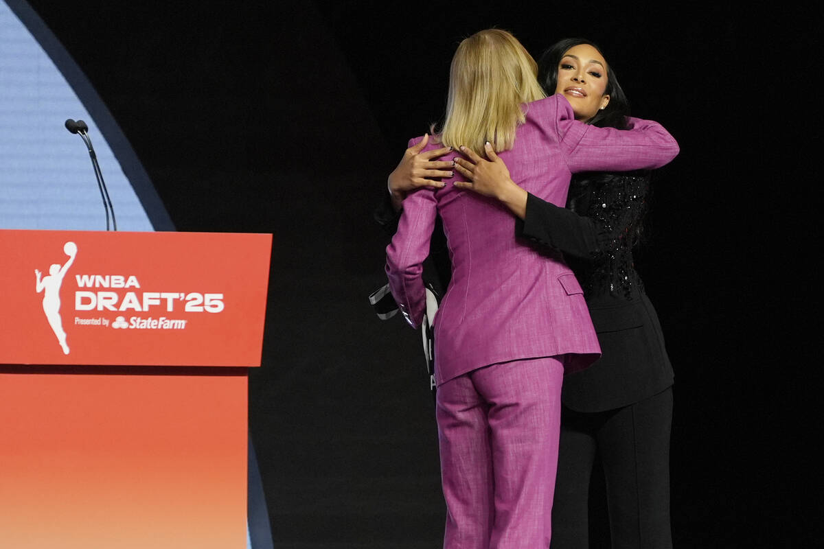 Alabama's Aaliyah Nye, right, embraces WNBA commissioner Cathy Engelbert after being selected 1 ...