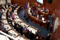 Senators and their guests recite the Pledge of Allegiance on the Senate floor in the Legislativ ...