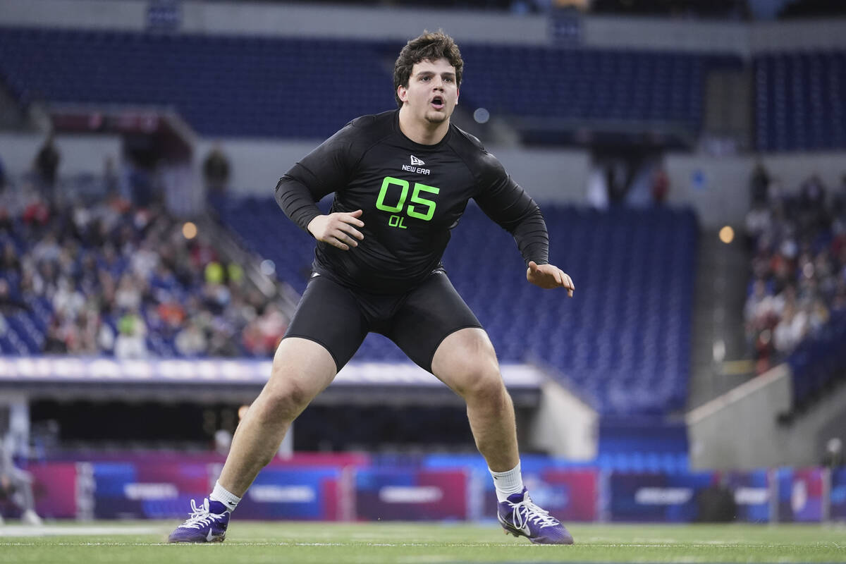 LSU offensive lineman Will Campbell runs a drill at the NFL football scouting combine in Indian ...