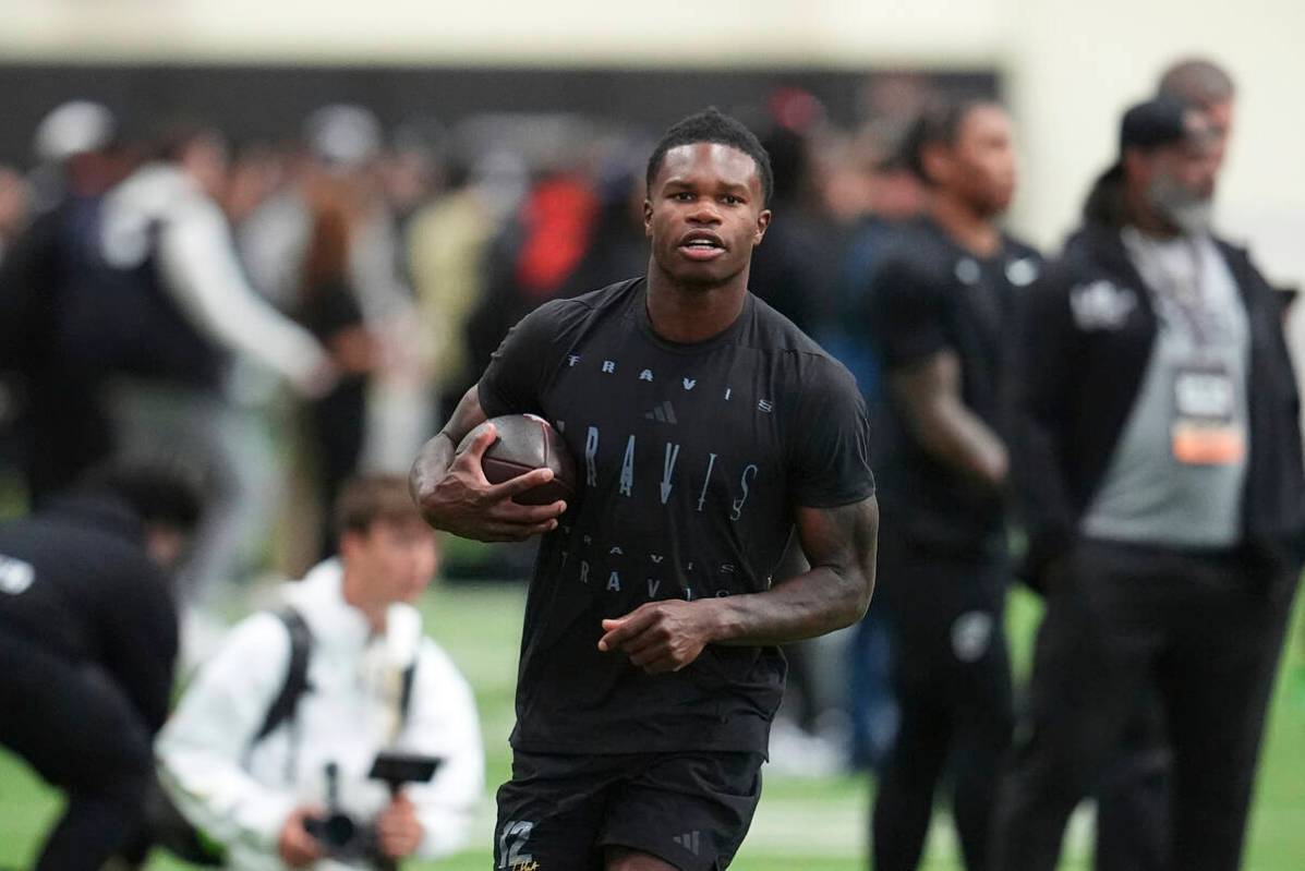 Colorado wide receiver Travis Hunter (12) takes part in passing drills during Colorado's NFL fo ...
