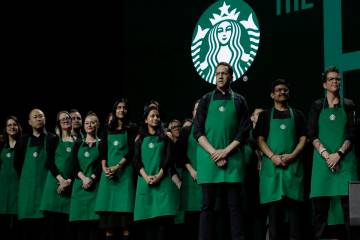 Starbucks baristas stand on stage, March 20, 2019, during an annual shareholders meeting in Sea ...