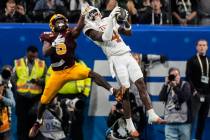 Texas defensive back Andrew Mukuba (4) intercepts a pass intended for Arizona State wide receiv ...