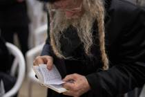 An ultra-Orthodox Jew participates in a blessing during the holiday of Passover, at the Western ...