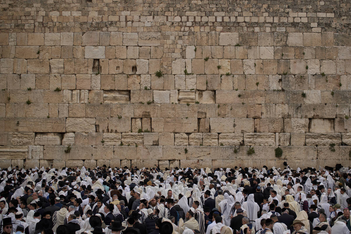 Covered in prayer shawls, Jewish men of the Cohanim Priestly caste participate in a blessing du ...