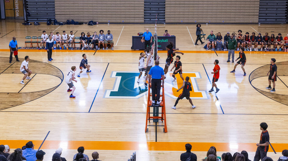 Mojave and Legacy players battle for a point during their 4A boys volleyball game on Tuesday, A ...