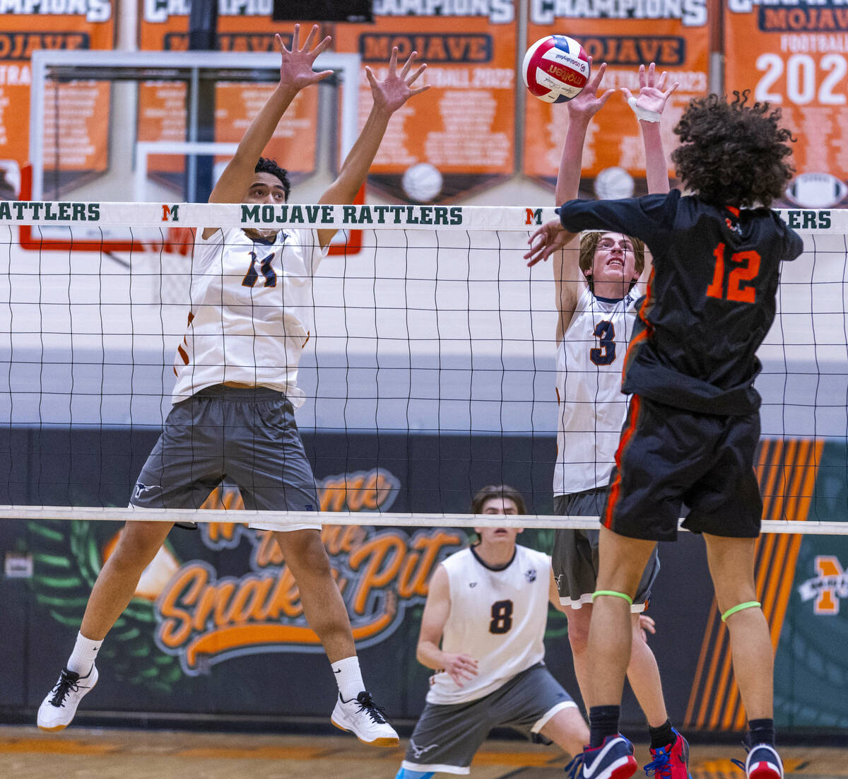 Legacy's Legacy's Atlys Tapusoa (11) and Isaac Schultz (3) attempt to block a shot by Mojave's ...