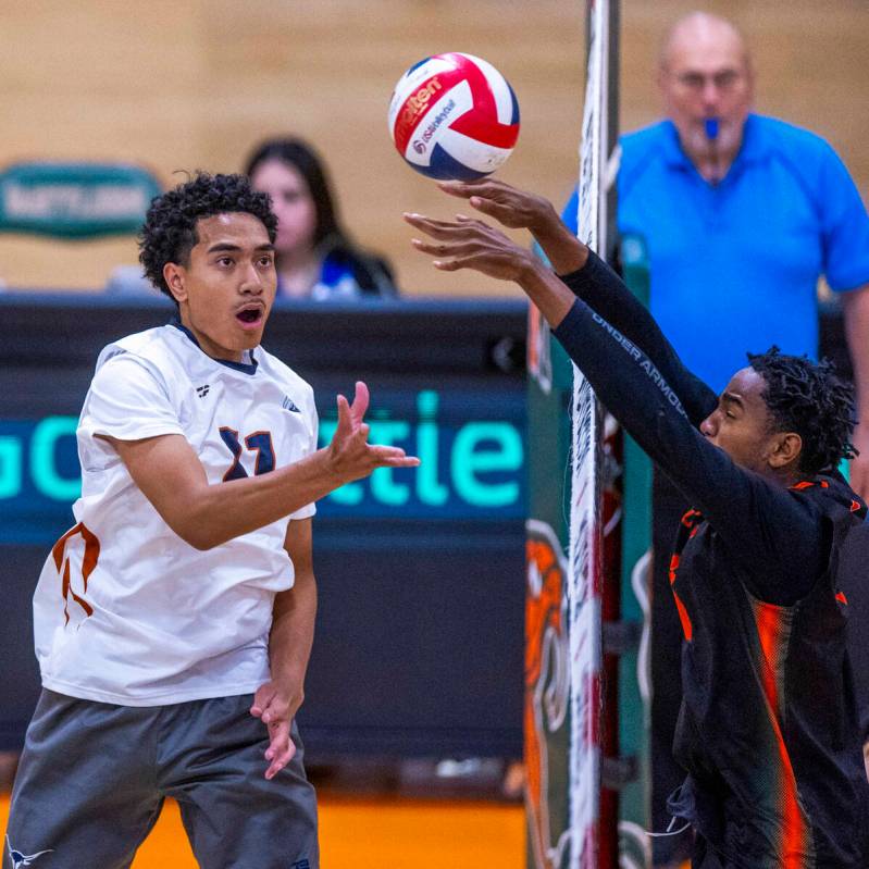 Legacy's Atlys Tapusoa (11) dinks the ball past a defection by Mojave's Jaion Richards (4) duri ...
