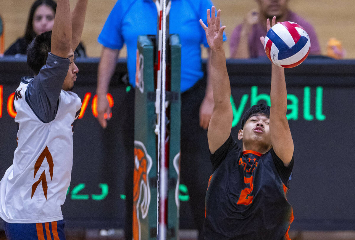 Mojave's Aaron Bagalawis (2) is unable to make a block against Legacy during their 4A boys voll ...