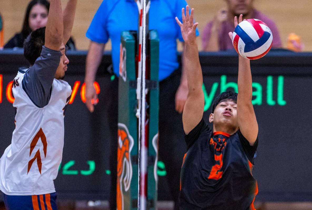 Mojave's Aaron Bagalawis (2) is unable to make a block against Legacy during their 4A boys voll ...