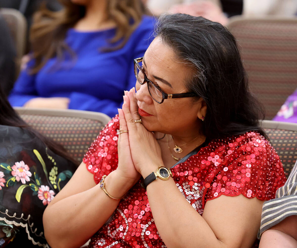 An audience member watches during a Clark County Commission meeting where commissioners approve ...