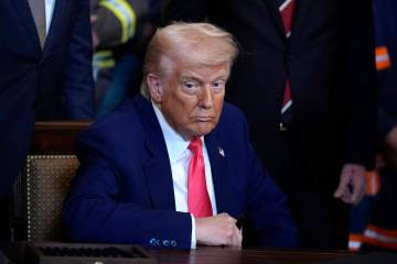 President Donald Trump signs a series of executive orders on energy production during a ceremon ...