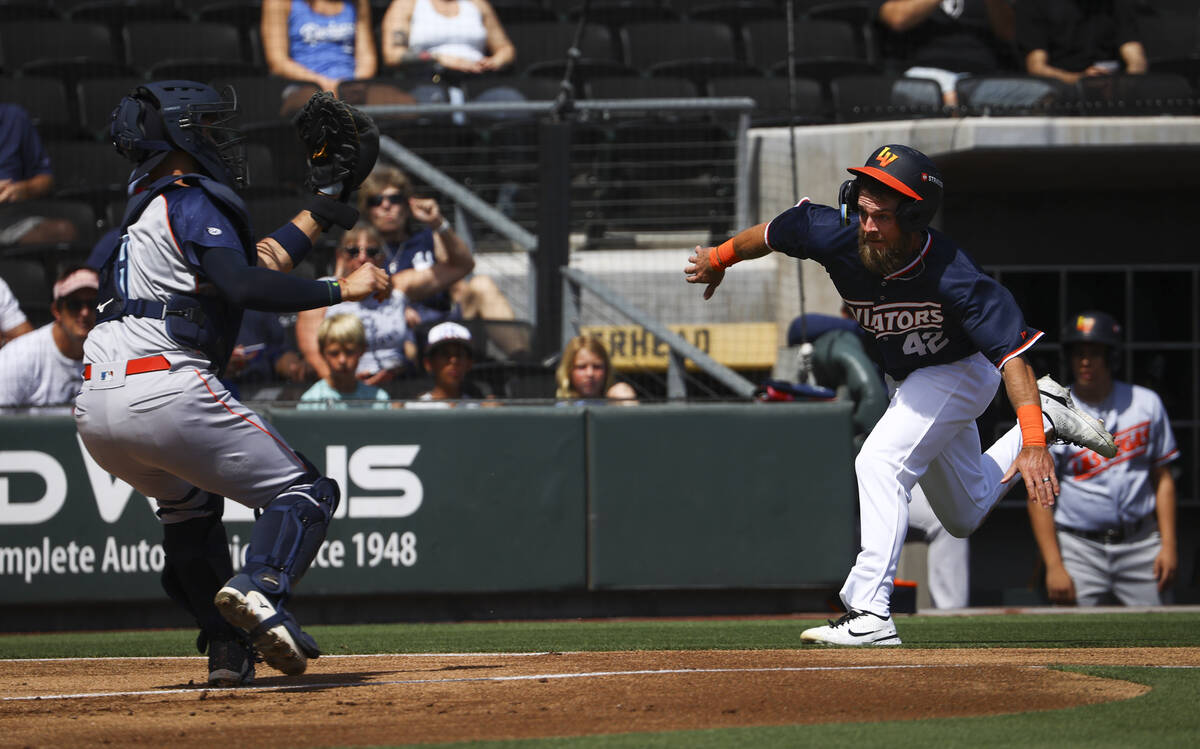 Aviators outfielder Drew Avans, right, tries to steal a run before getting tagged out by Sugar ...