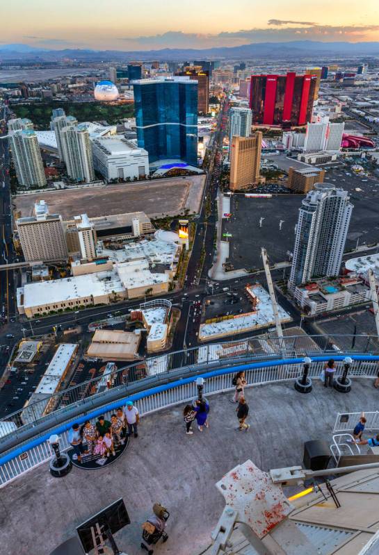 Visitors take in the skyline from the observation deck atop the STRAT on the North end of the S ...