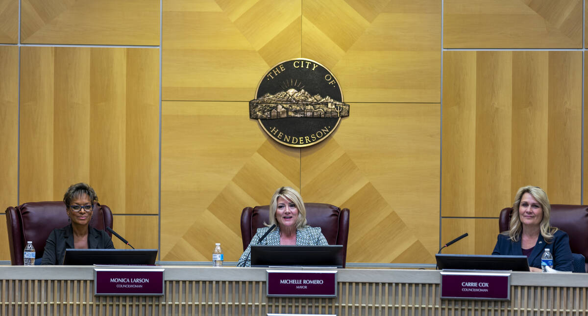Mayor Michelle Romero, center, Councilwomen Monica Larson, left, and Carrie Cox, right, watch a ...