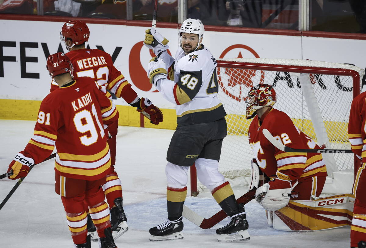 Vegas Golden Knights' Tomas Hertl (48) celebrates his team's goal as Calgary Flames goalie Dust ...