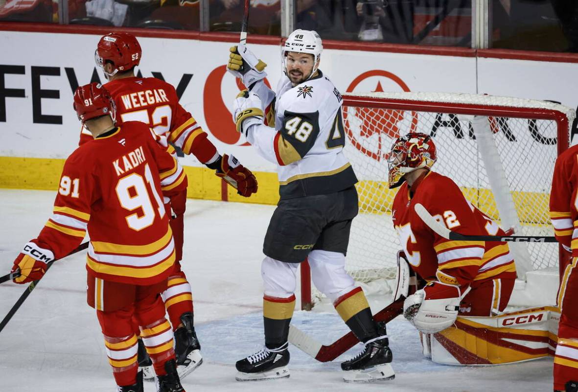 Vegas Golden Knights' Tomas Hertl (48) celebrates his team's goal as Calgary Flames goalie Dust ...