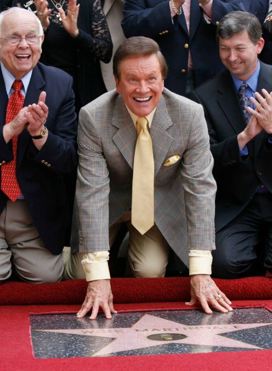 Game show host Wink Martindale smiles for media and supporters after being honored with a star ...