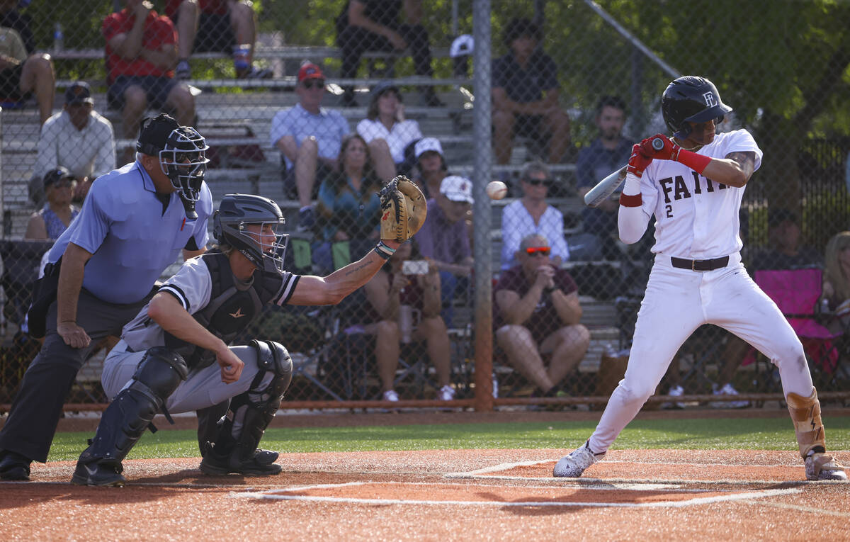Palo Verde catcher Brady Dallimore, left, reaches for the ball as Faith Lutheran's Kingston Kel ...