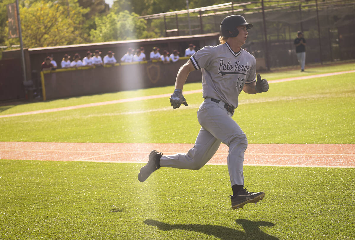 Palo Verde catcher Brady Dallimore runs bases after hitting a double during a baseball game at ...