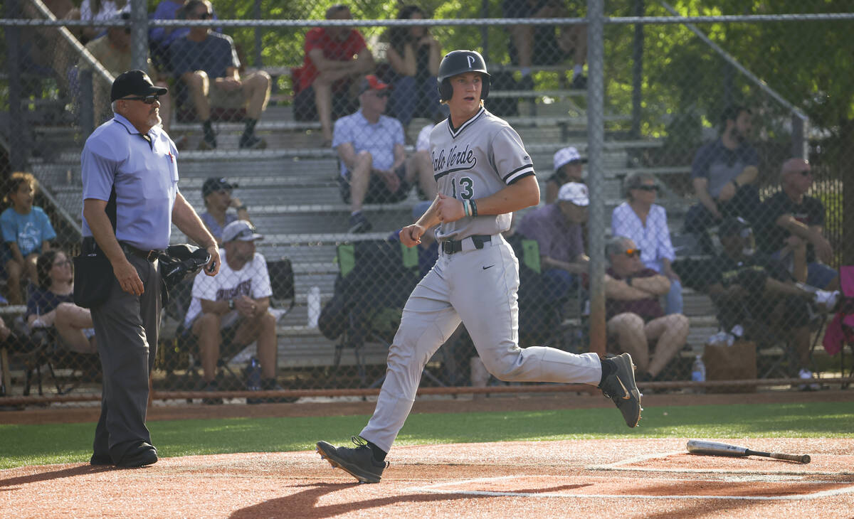 Palo Verde catcher Brady Dallimore scores a run during a baseball game at Faith Lutheran High S ...