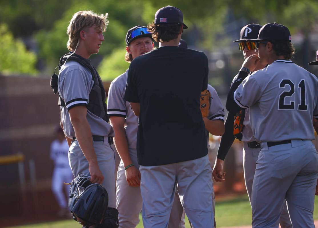 Palo Verde catcher Brady Dallimore, left, joins his teammates and a coach at the pitcher&#x2019 ...