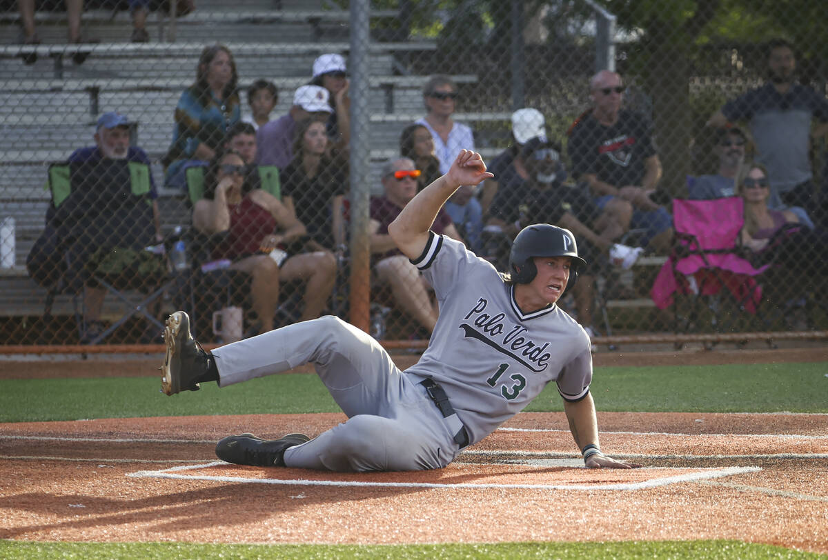 Palo Verde catcher Brady Dallimore scores a run during a baseball game at Faith Lutheran High S ...