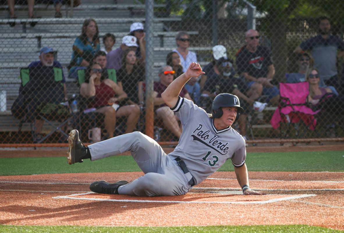 Palo Verde catcher Brady Dallimore scores a run during a baseball game at Faith Lutheran High S ...