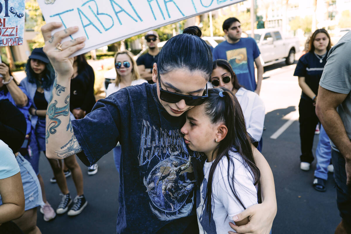 Alicia Lozoya, left, holds onto Macy Diaz, 8, as they get emotional during a demonstration in m ...
