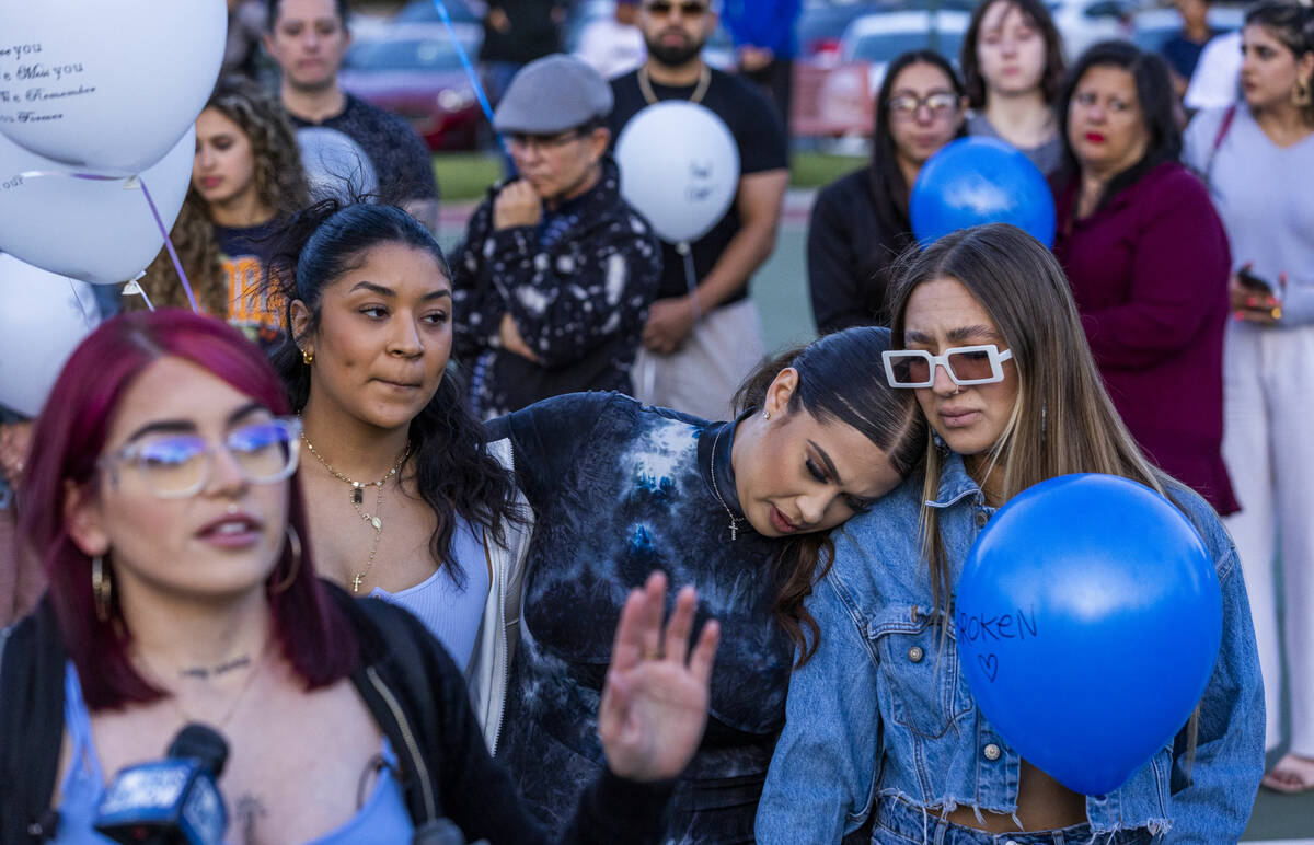 Friends gather as Alicia Lozoya, left, speaks about Tabatha Tozzi, 26, recently killed and now ...