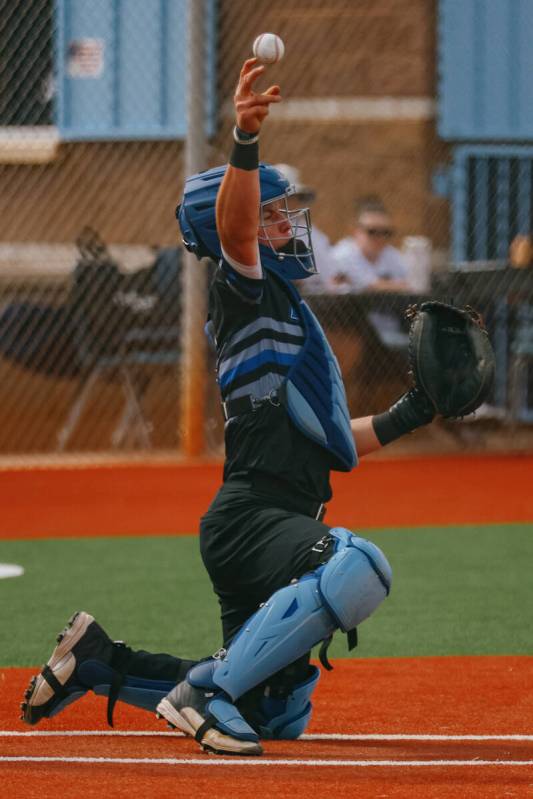Basic catcher Koa Won (4) tosses the ball back to the pitcher during the baseball game against ...