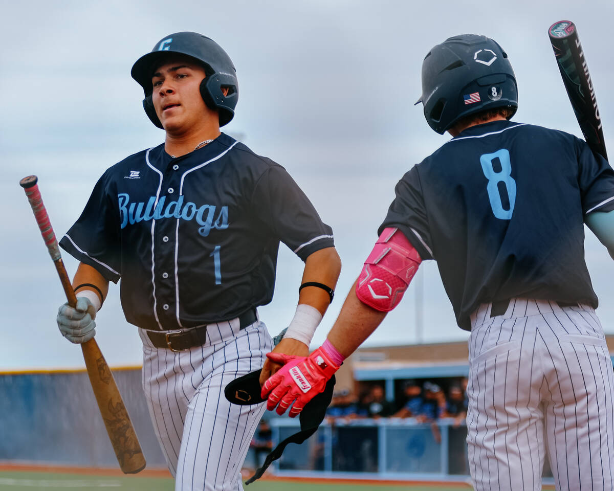Centennial’s Kobe Peterson (8), right, congratulates teammate Giovanni Telfer (1) on ear ...