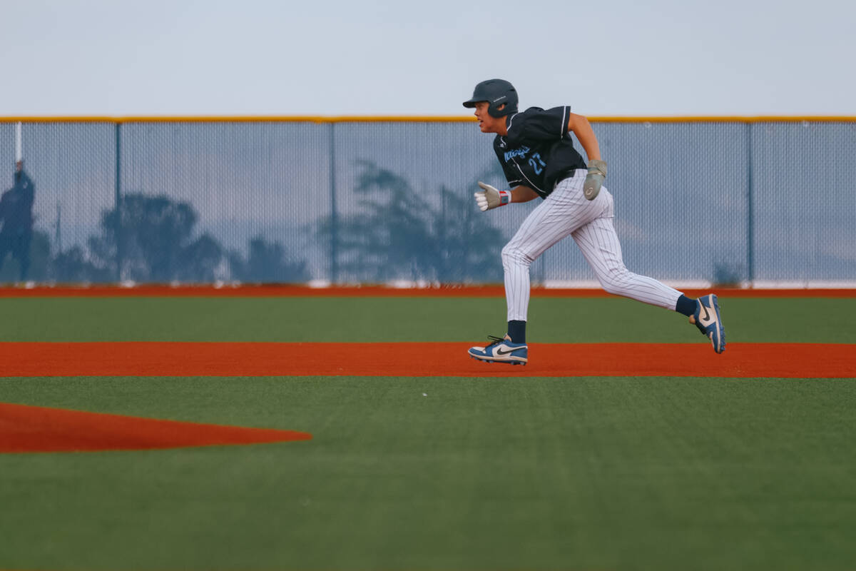 Centennial’s Jake Turner (27) makes a run for second base during the baseball game again ...