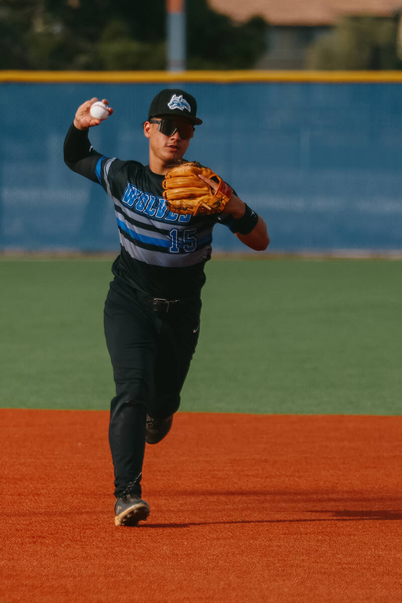 Basic second baseman Lyndon Lee (15) throws to first base to attempt a putout during the baseba ...