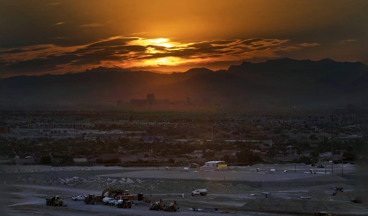 The sun rises over the valley and the Strip on another high temperature day on July 20, 2023, i ...