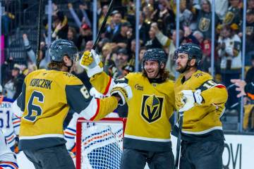 Golden Knights defenseman Kaedan Korczak (6), left wing Brandon Saad (20) and center Nicolas Ro ...