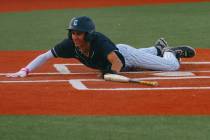 Centennial’s Chase Hurley (30) slides into home plate, earning the game-winning run for ...