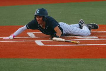 Centennial’s Chase Hurley (30) slides into home plate, earning the game-winning run for ...