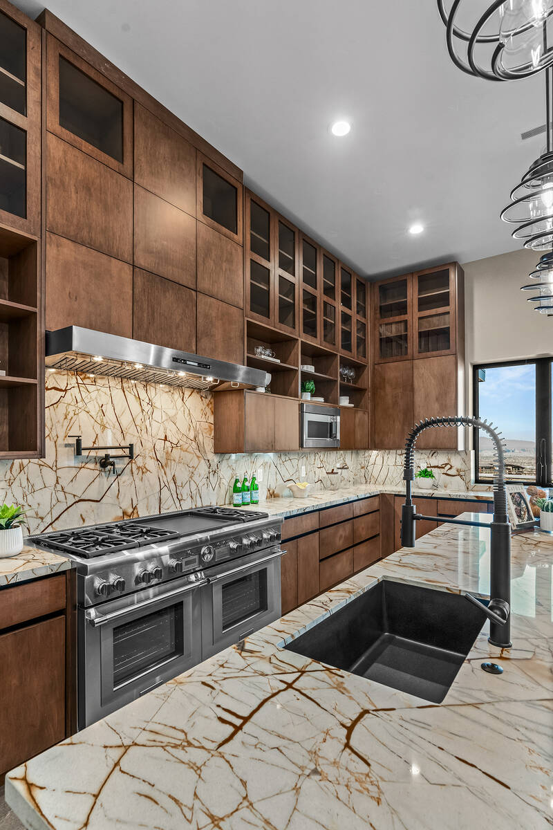 The kitchen features unique countertops. (Stetson Ybarra/Rooted Elements)