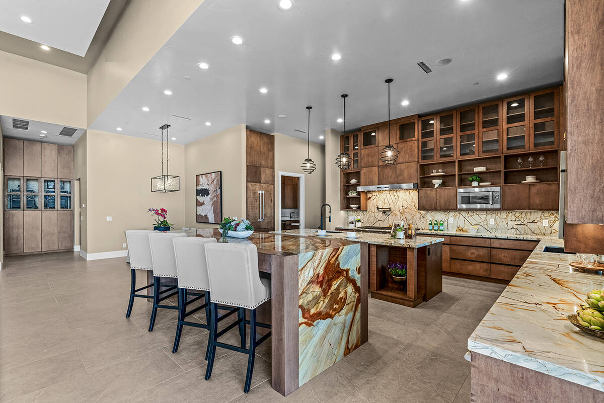 The kitchen has a "party" island with seating. (Stetson Ybarra/Rooted Elements)