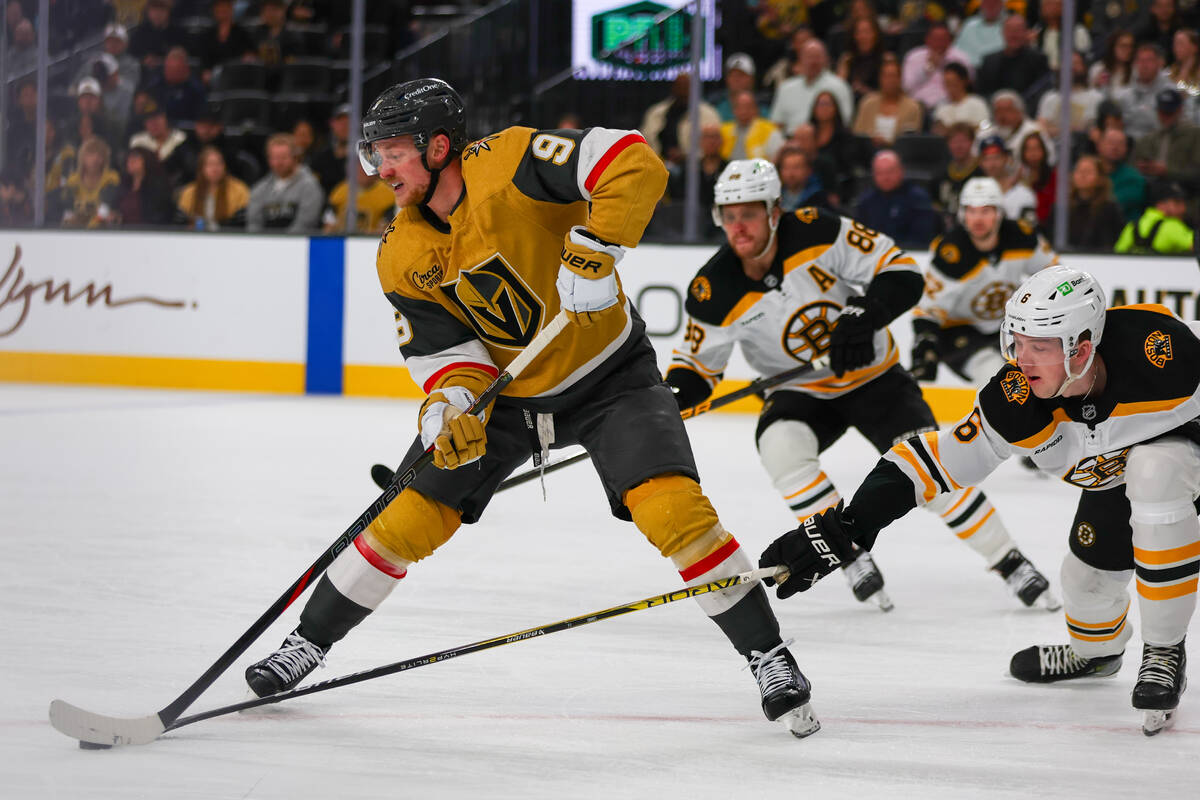 Golden Knights center Jack Eichel (9) skates with the puck against Boston Bruins defenseman Mas ...