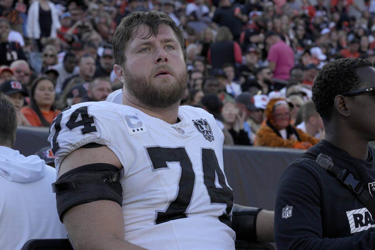 Las Vegas Raiders offensive tackle Kolton Miller is carted off the field during the first half ...