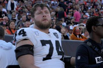 Las Vegas Raiders offensive tackle Kolton Miller is carted off the field during the first half ...