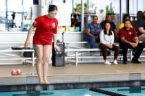 Yeiar Lerma, a lifeguard at Hollywood Aquatics Center, jumps into a swimming pool as she demons ...