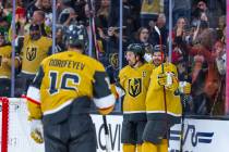 Golden Knights right wing Mark Stone (61) and center Tomas Hertl (48) celebrate his goal agains ...