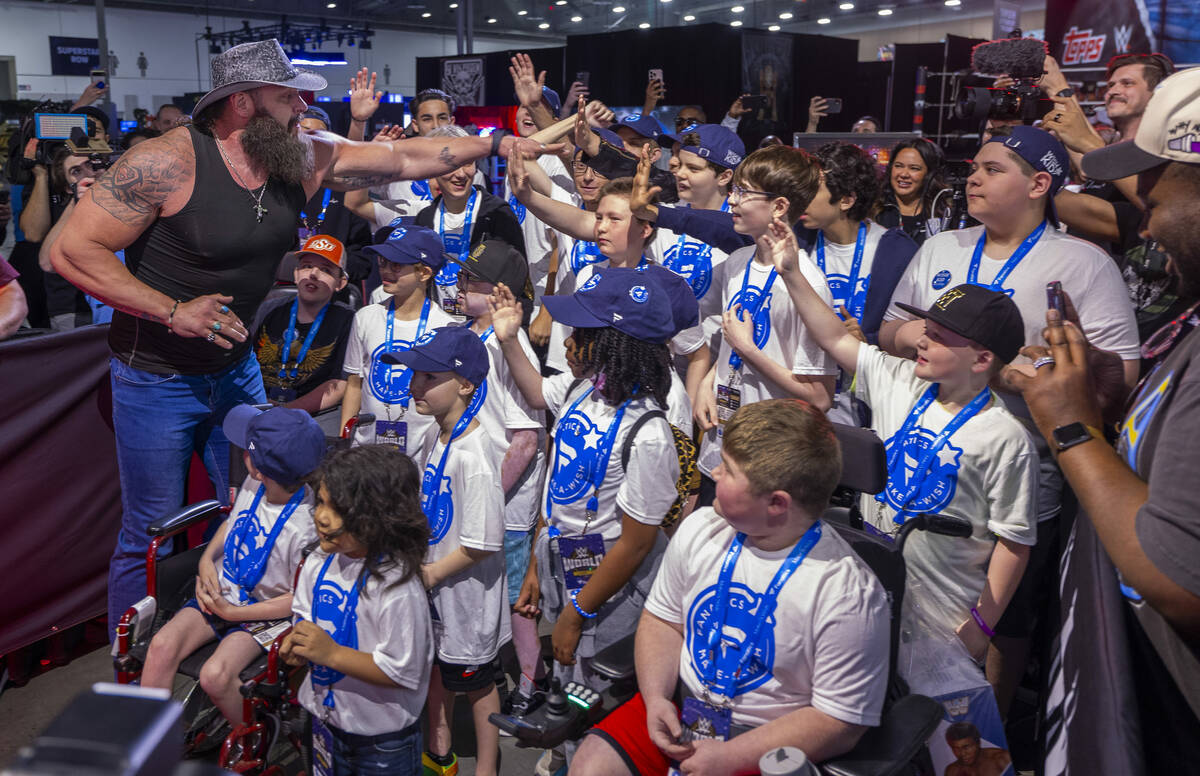 WWE wrestler Braun Strowman greets Make-A-Wish kids as they and Fanatics team up with the WWE t ...