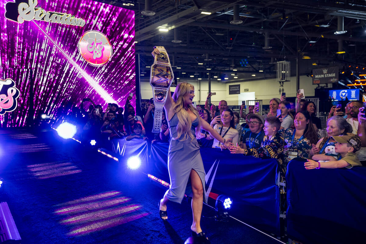WWE wrestler Tiffany Stratton arrives on stage as Make-A-Wish and Fanatics team up with the WWE ...
