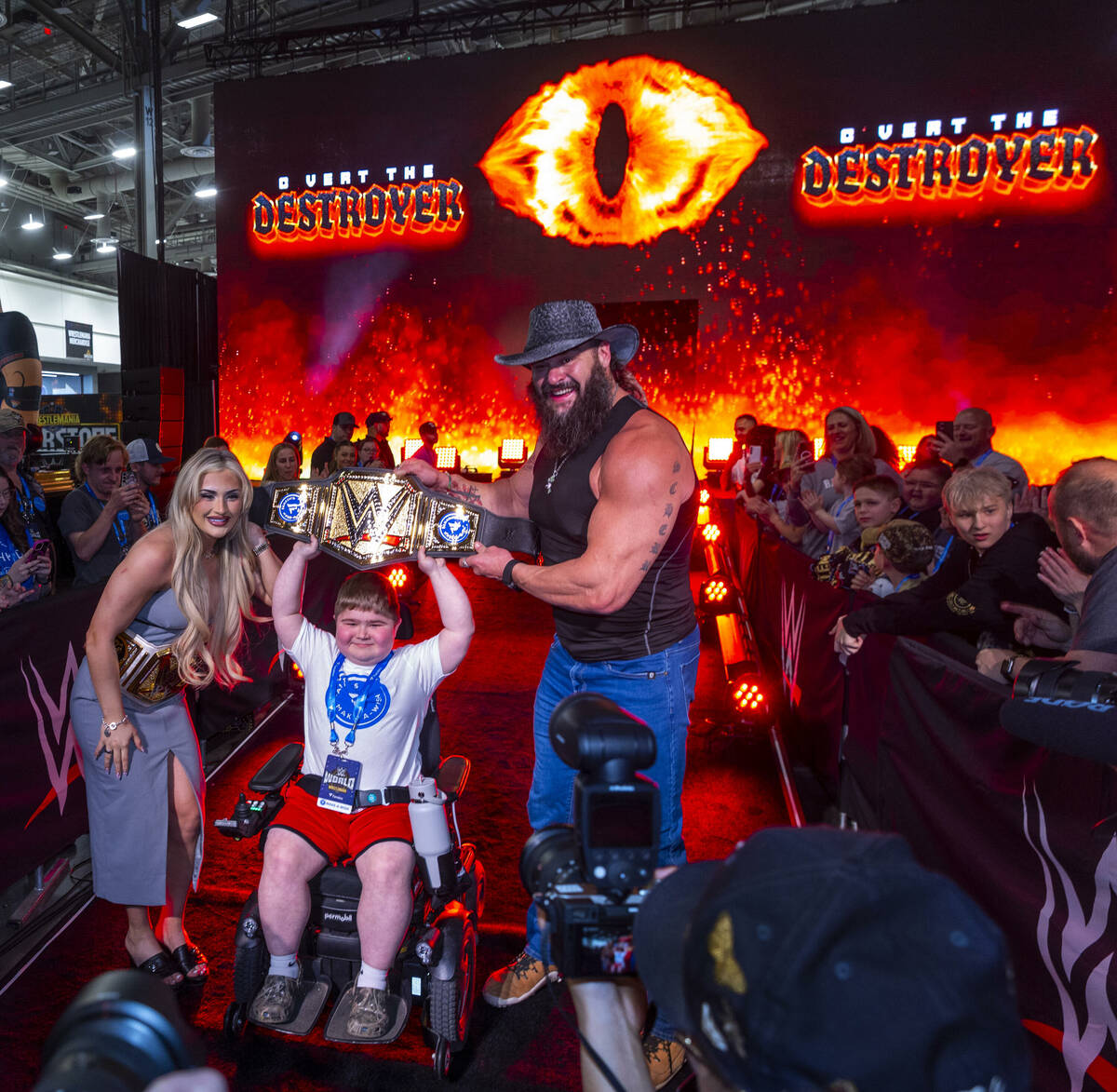 Make-A-Wish kid Charlie "C Vert The Destroyer" Vertin holds his title belt with wrest ...