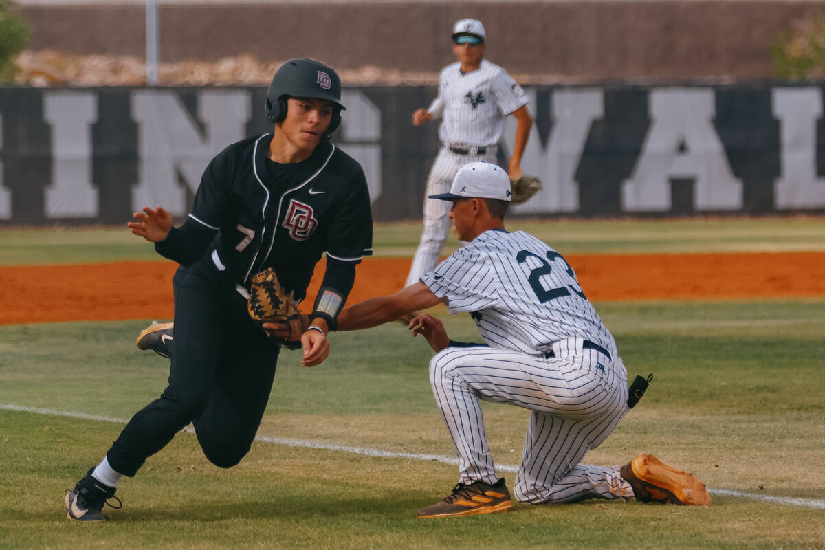 Spring Valley infielder Keegan Cushenberry (23) tags out Desert Oasis’ Brody Griffith (7) dur ...