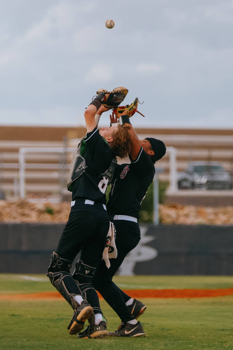 Desert Oasis catcher Landon O’Dell (8) and pitcher Sebastian Frye (3) nearly collide whi ...