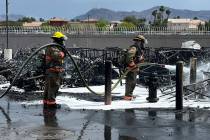Clark County Fire Department crews work to extinguish a fire at RideNow Powersports near the co ...
